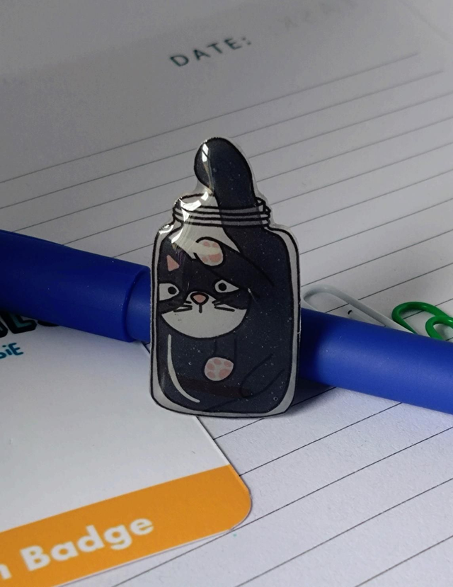 Cat in a jar pin badge