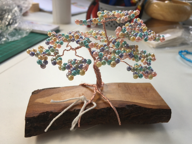 Coloured Pearl beads on wood