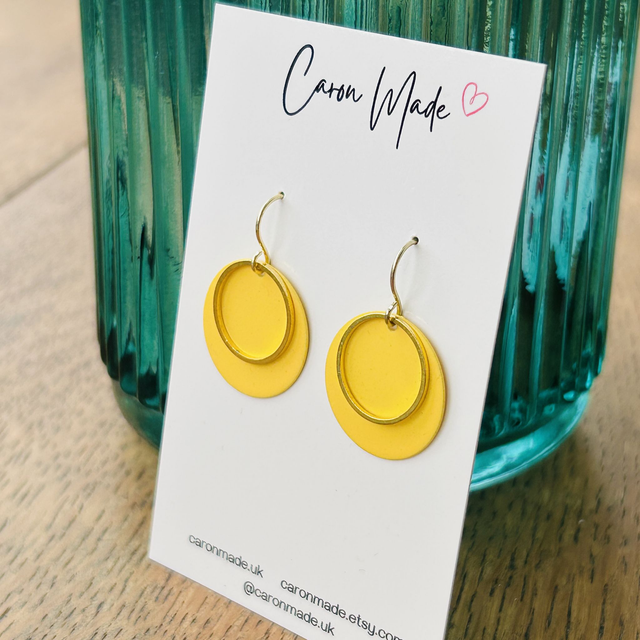 Yellow and gold metal circle earrings
