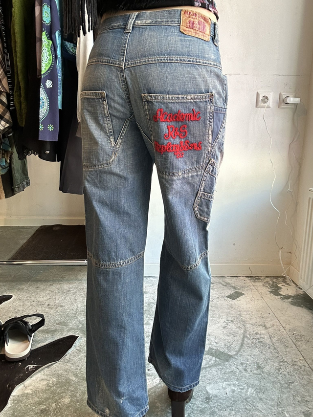 jeans with red embroidery on back pocket