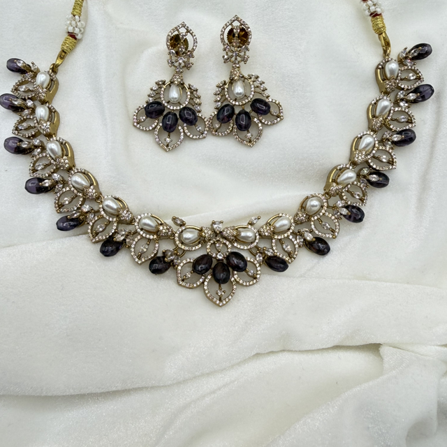 Gold Finished Bridal Necklace Set with White PearlsDark Gemstone Accent