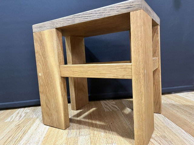 Oak cantilever stool made of solid oak wood in two colors.