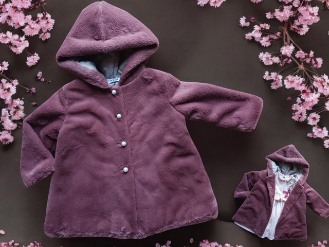 Manteau fausse fourrure 12m