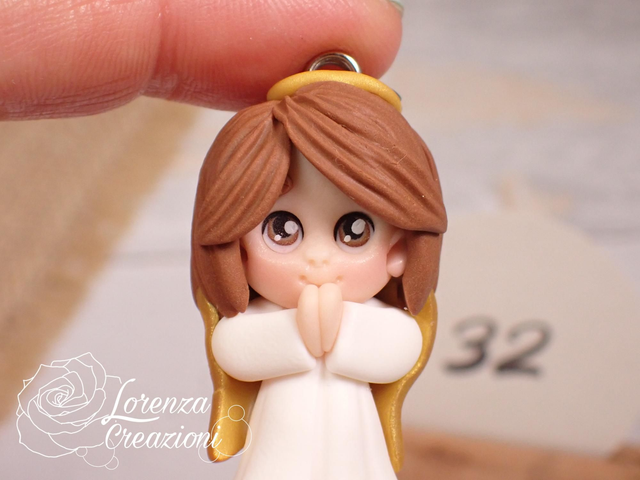 Angioletto custode tascabile n. 32
Portachiavi o charm, artigianale, pezzo unico. Modellato a mano argilla polimerica, made in Italy.
