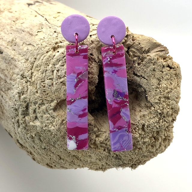 Magenta long stud drops