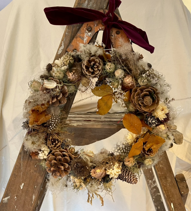 autumn wreath in neutral tones with wine red velvet ribbon