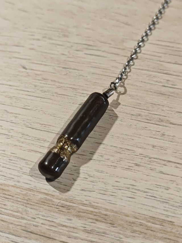 Pendule baton - marron et doré 