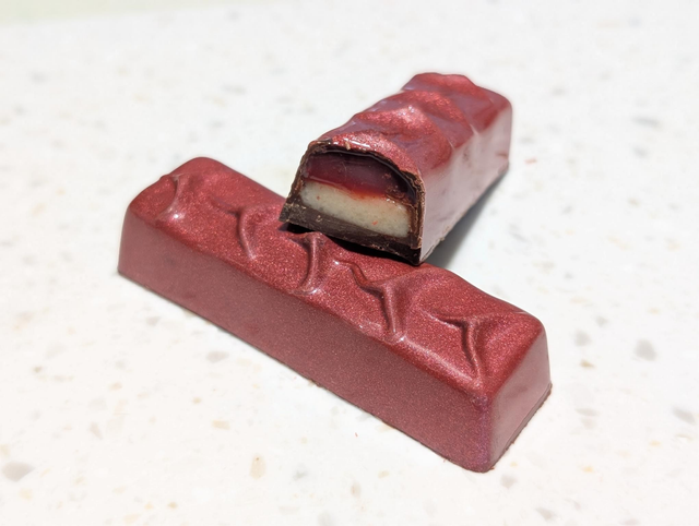 Dark chocolate bar filled with cherry caramel and marzipan 