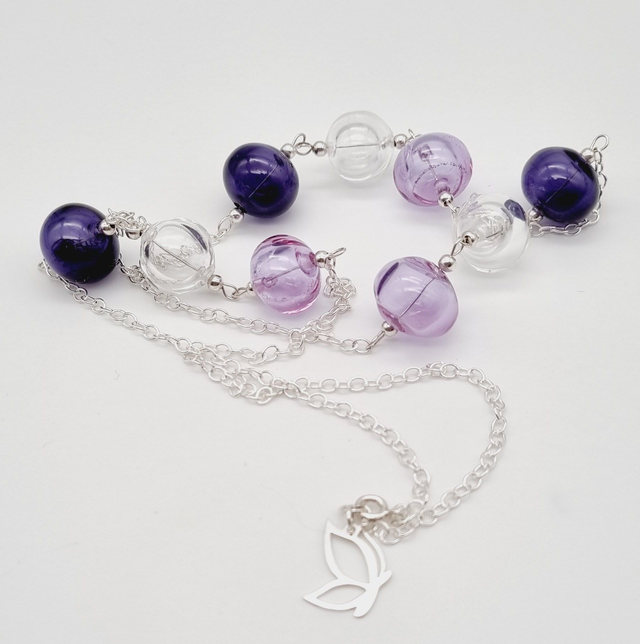 Sautoir perles creuses violettes