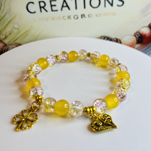 Geluksarmband ‘Golden Heart’ – met Klavertjevier en Hart Bedels