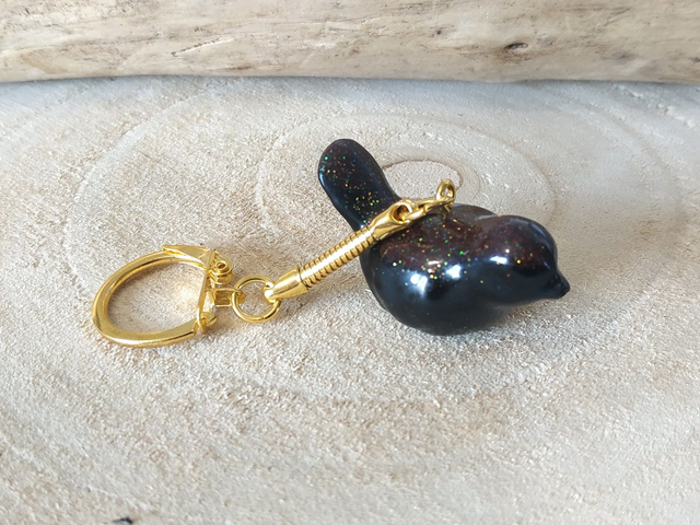 Porte-clés oiseau noir pailleté