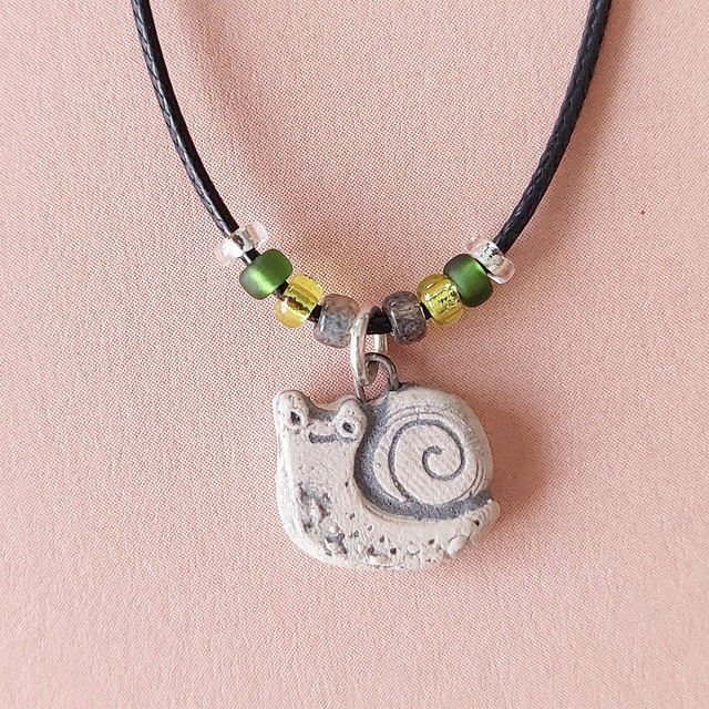 Tiny snail ceramic charm - handmade - unisex slug pendant - rustic clay snail bead