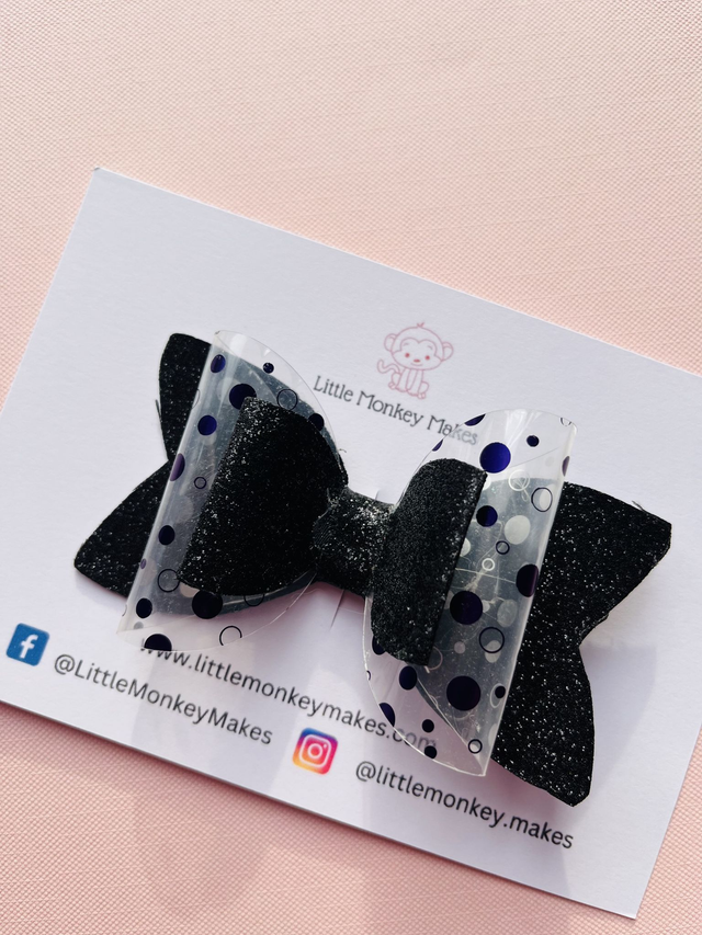 Black leather bow with purple acetate