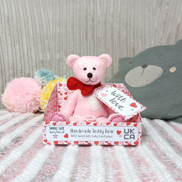 Label: 'With love'. Small size, handmade teddy bear. UKCA. Tray base packaging. Standard Wool Felt. Pink. Red. White.