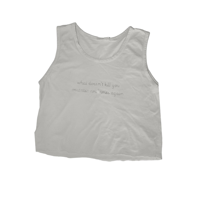 white top with holographic text "what doesn't kill you, mutates and tries again" size XL