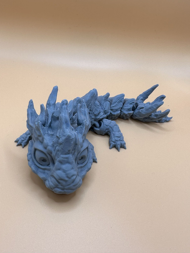 Articulated stone baby dragon