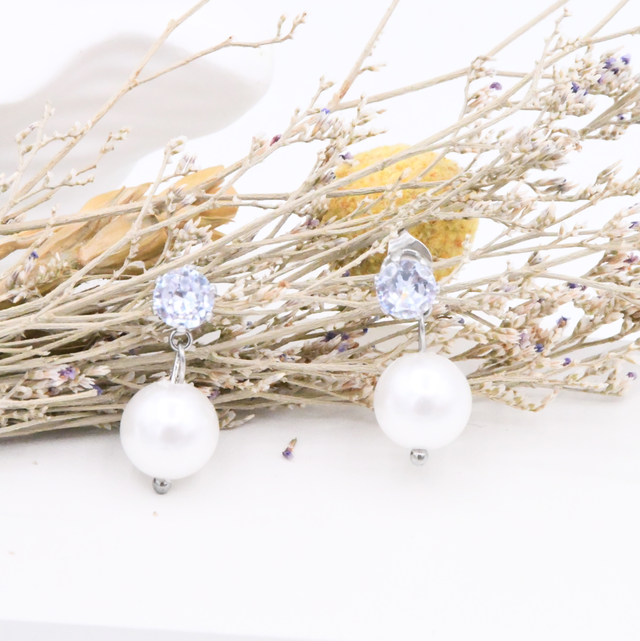 Boucles d’oreille strass avec perle 