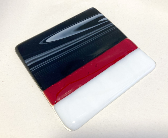Black, white and red coaster 