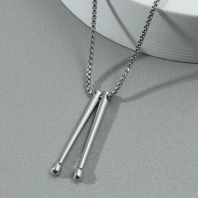 Pendentif, baguette de batterie 