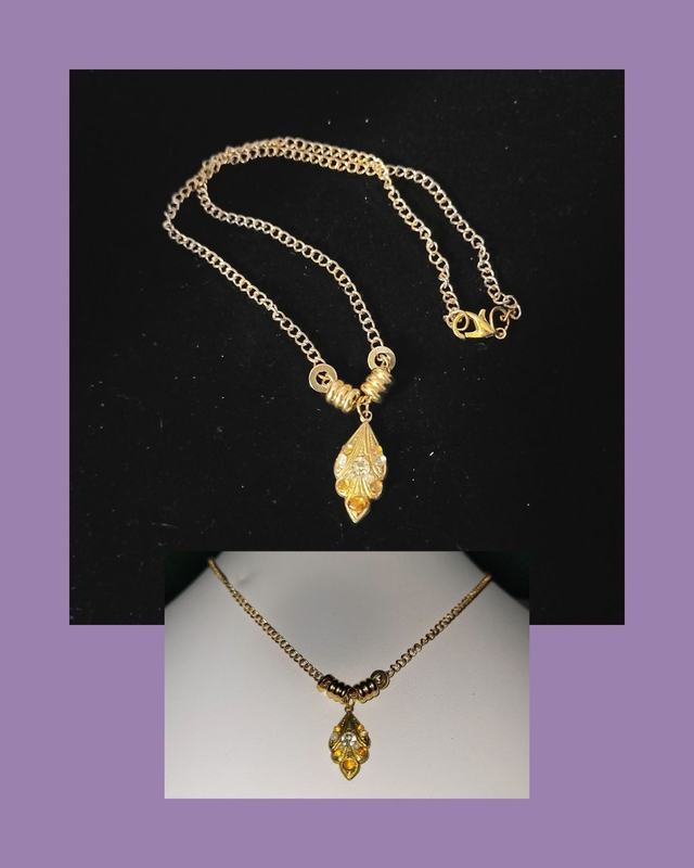 Gold Pendant With Mounted Gems