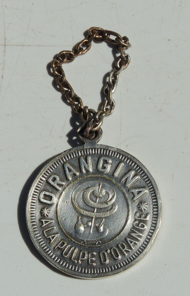 Porte-clés publicitaire ancien Orangina
