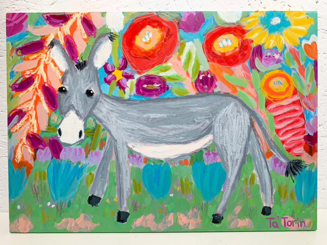 Donkey strolls through the flowers