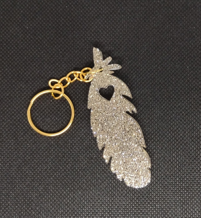 Porte clés plume coeur paillettes argentées 