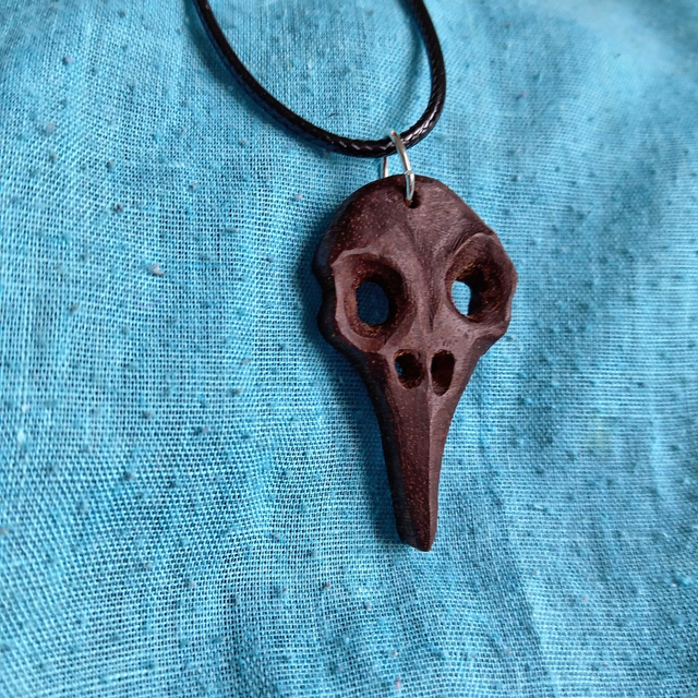Pendentif crane d'oiseau aux yeux creux