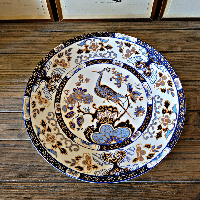 Grand plat (32cm) chinois en porcelaine, décor floral avec oiseau (paon/héron) bleu et or