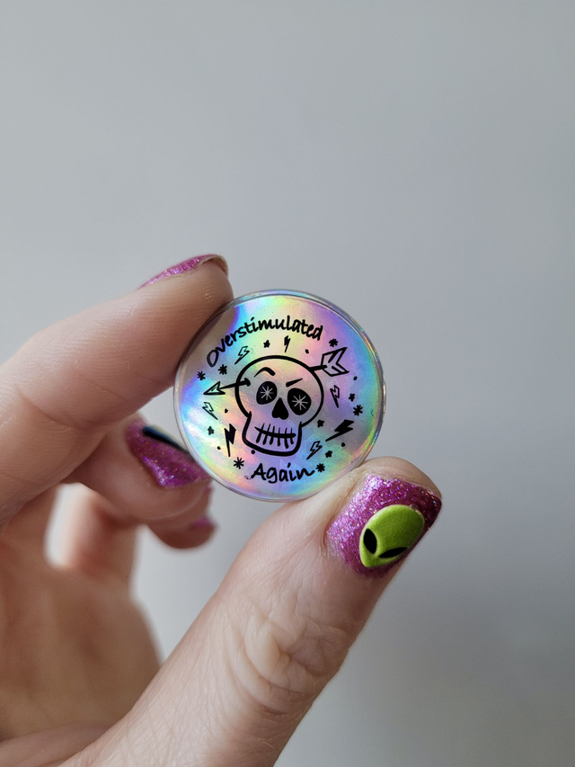 Holographic Overstimulated Again Skull Badge