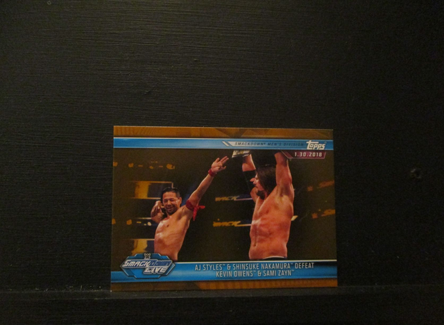AJ Styles &amp; Shinsuke Nakamura Defeat Kevin Owens &amp; Sami Zayn - Brown Champions Original Trading Card #86