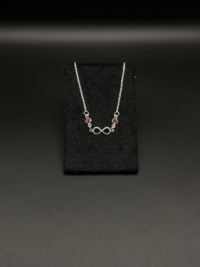 Pulseira entremeio infinito e zircônia rosa