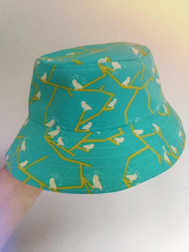 Hat - approx 5-8 yrs.   Birds