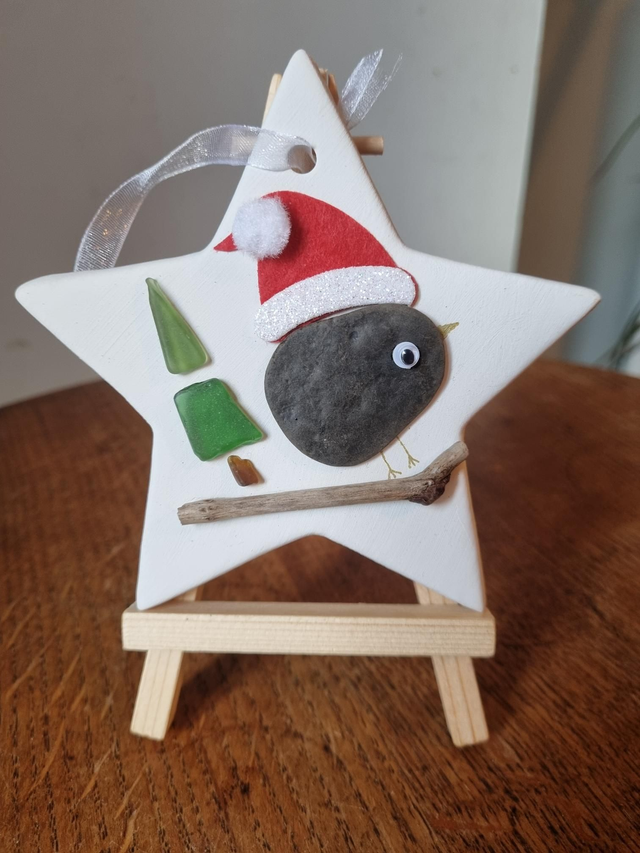 Ceramic decoration - bird on sleigh