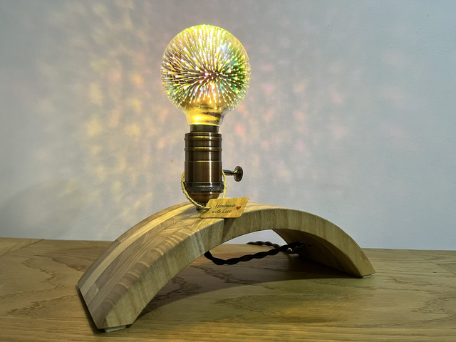 Stylish decorative lamp made of Paulownia wood with a 3D light bulb.