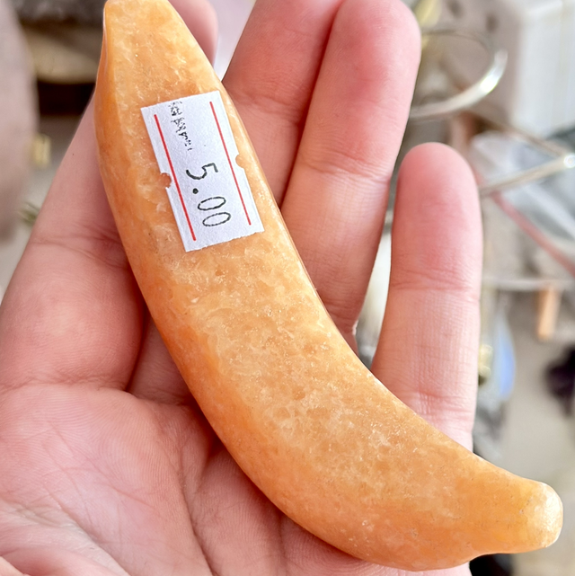 Orange calcite banana carving