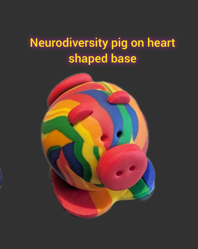 Neurodiversity pig on heart shaped base