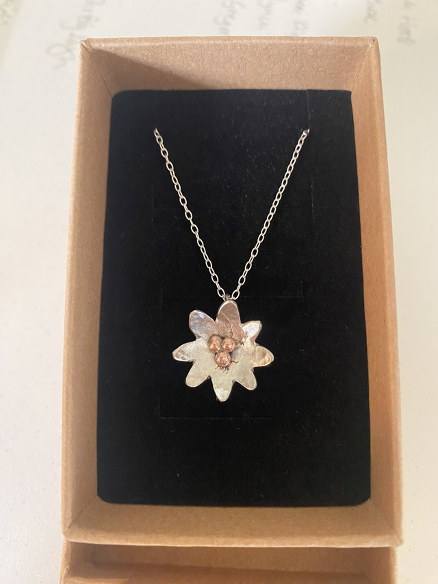 Lilly in hammered sterling silver with copper detailing