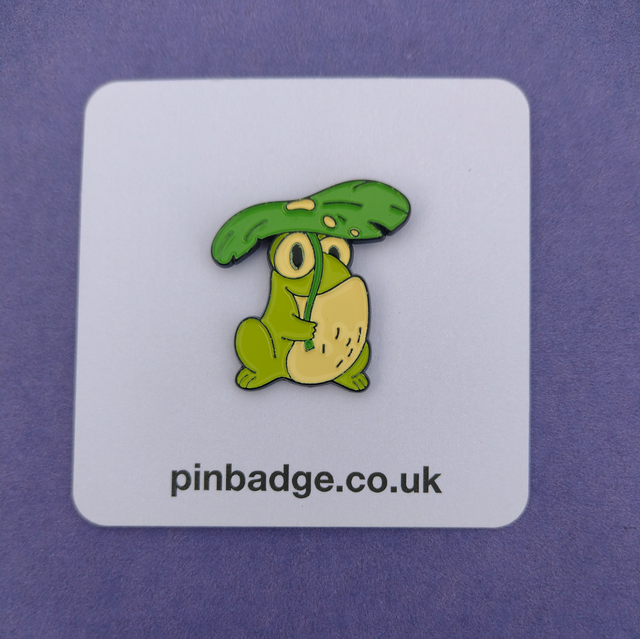 Frog under a leaf umberella