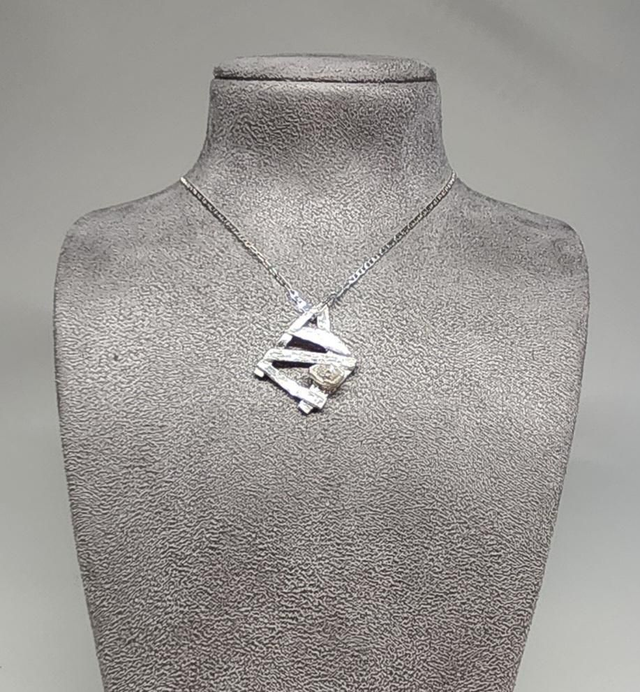 Abstract 'gate' with clear navette cubic zirconia pendant