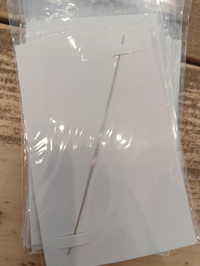 Huismerk: Rijgnaald doorsteekoog