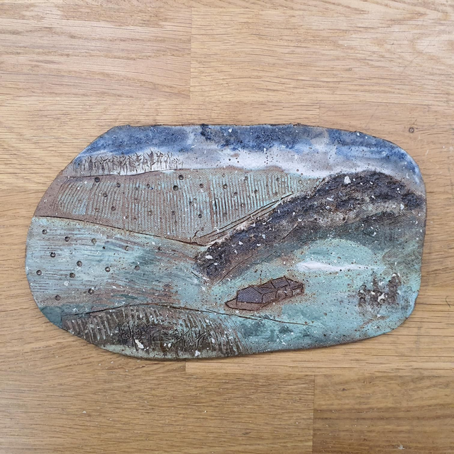 Snow falling rural ceramic landscape