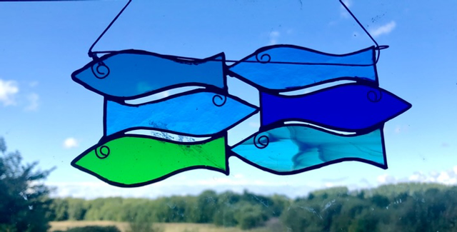 6 fishes in stained glass.