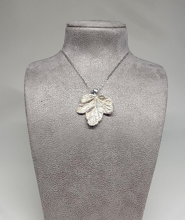 Viburnum leaf pendant on silver necklace