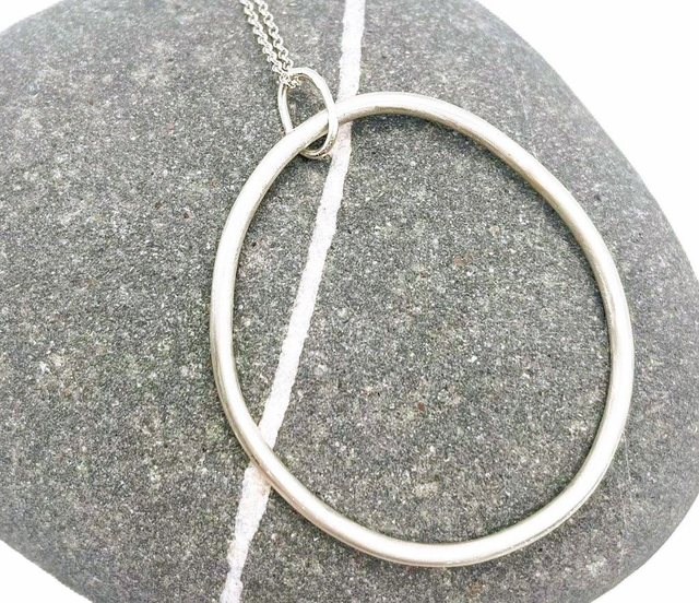 Large sterling silver statement hoop pendant