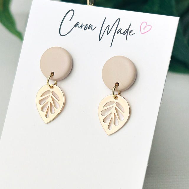 Small beige neutral stud and golden leaf earrings