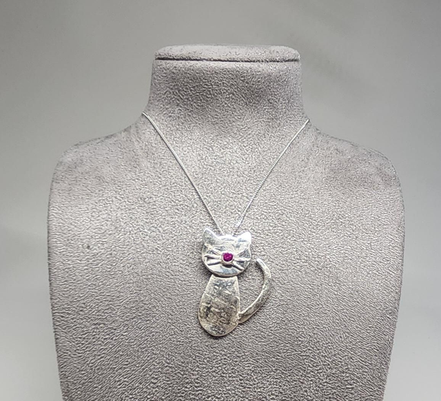 Cat pendant with fuchsia cubic zirconia on silver necklace