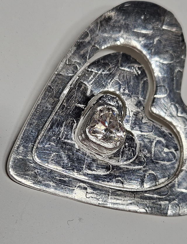 Large heart pendant with clear heart shaped cubic zirconia