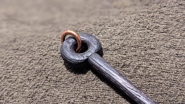 Black hardwood ringed pin