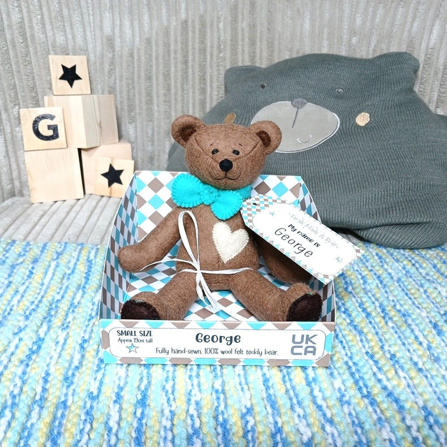 George. Small size, handmade teddy bear. UKCA. Tray base packaging. Standard Wool Felt. Brown. Teal. beige.